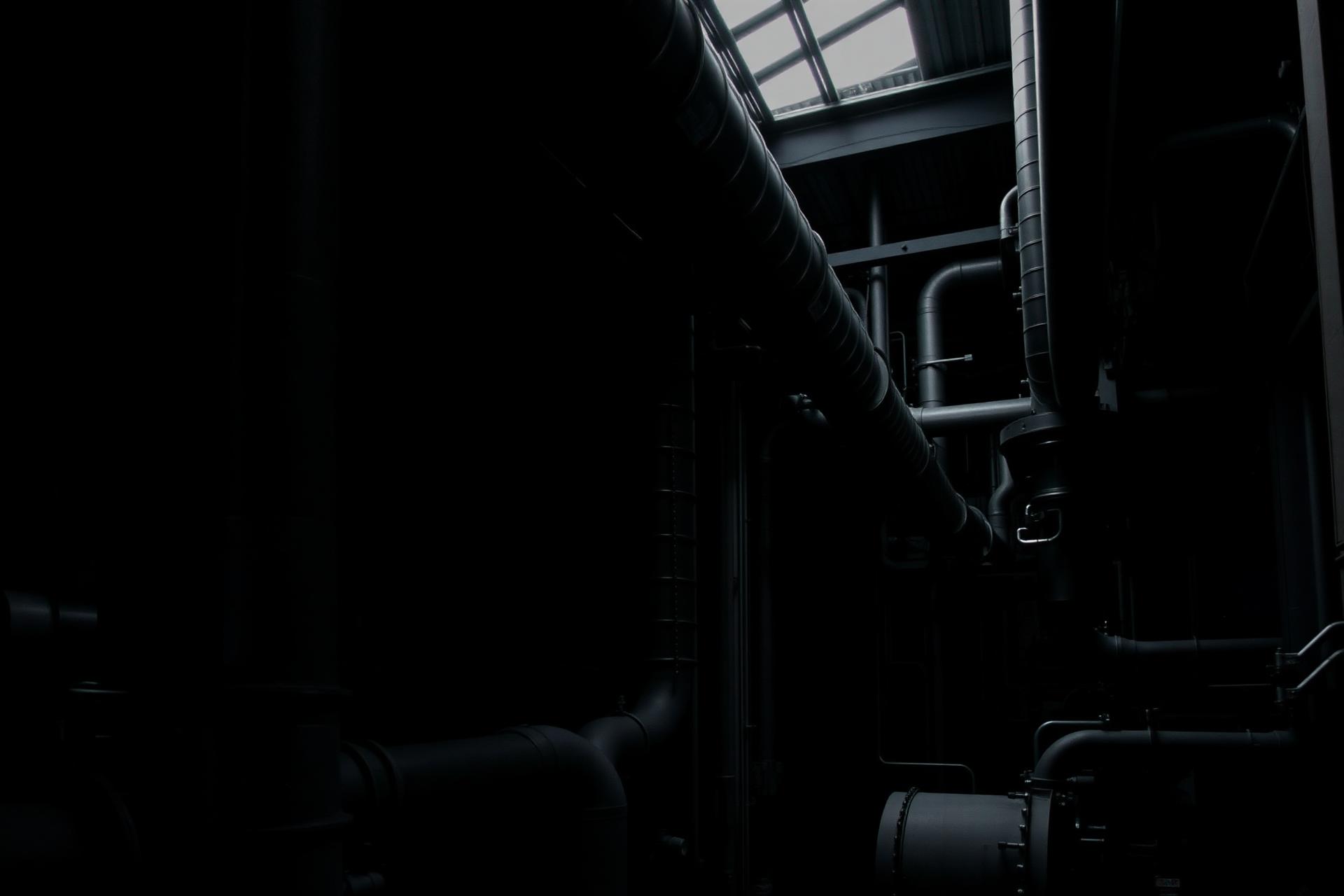 Industrial factory interior with pipes and machinery